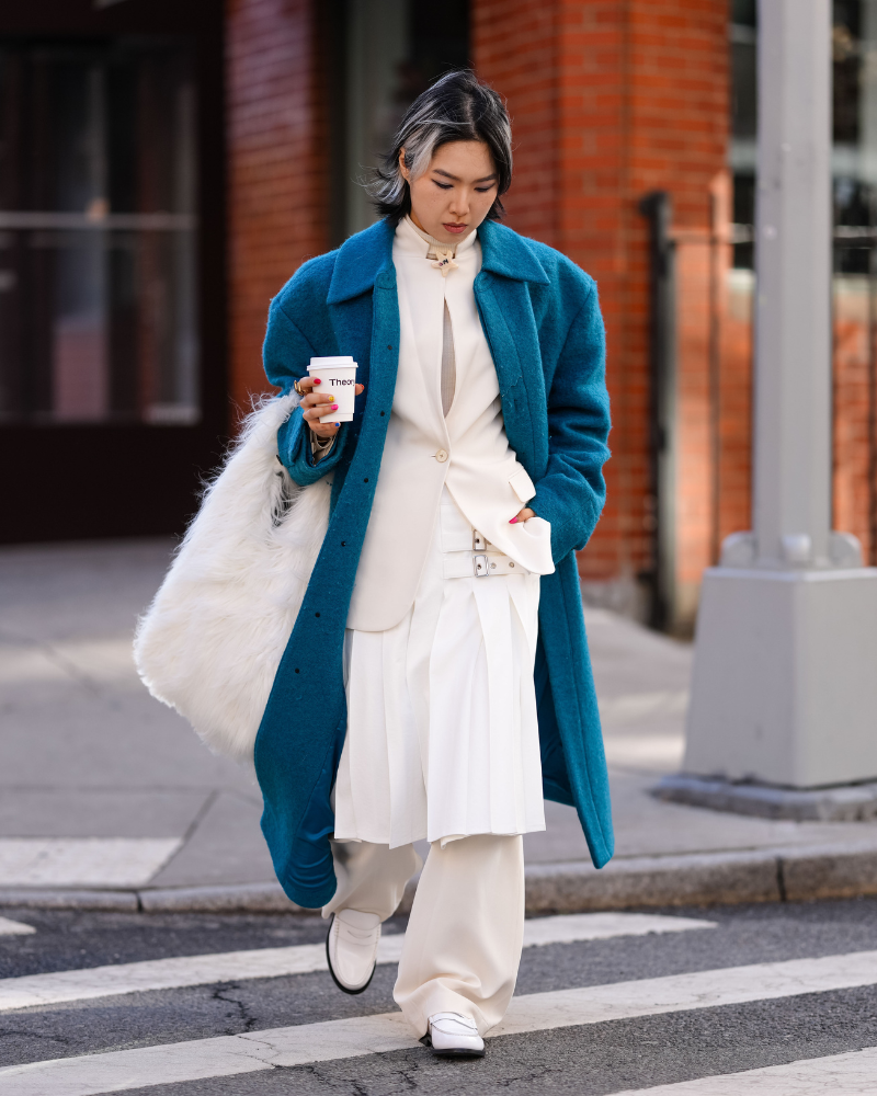 Vibrant Teal Coat Over Cream Layers: A Sophisticated Contrast — NYC Winter Outfits