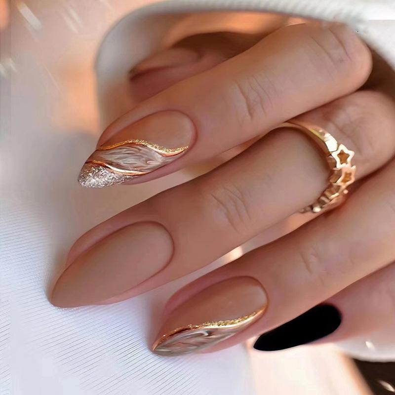 Matte Nude with Gold Swirls and Glitter Almonds — Winter Almond Nails