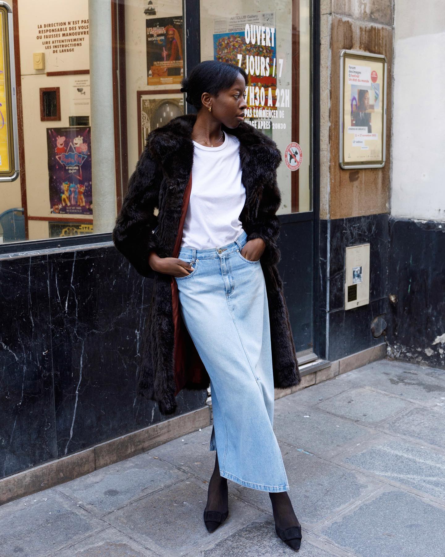 Dark Fur Coat Over Denim Skirt and Tights for a Contrasting Winter Style Dark Fur Coat Over Denim Skirt and Tights for a Contrasting Winter Style — Winter Photoshoot Outfits