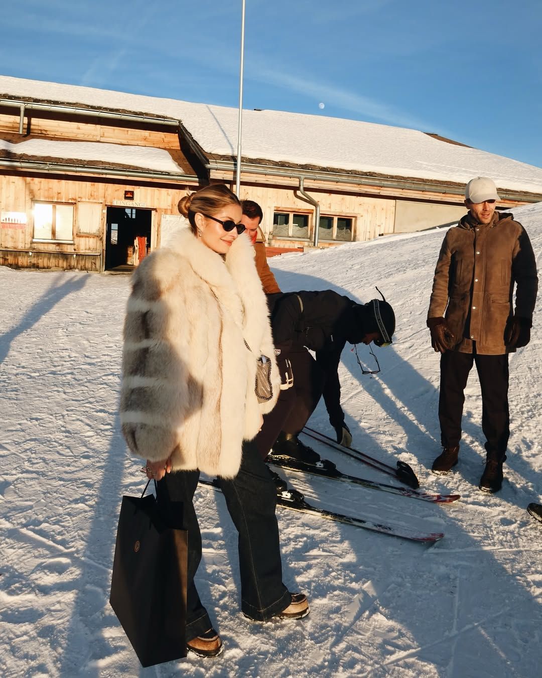 Cream Faux Fur Coat with Flared Jeans for a Chic Snow Day — Snow Day Outfits