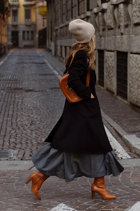 Long Black Coat Over Tiered Skirt and Beanie — Late Winter Outfits