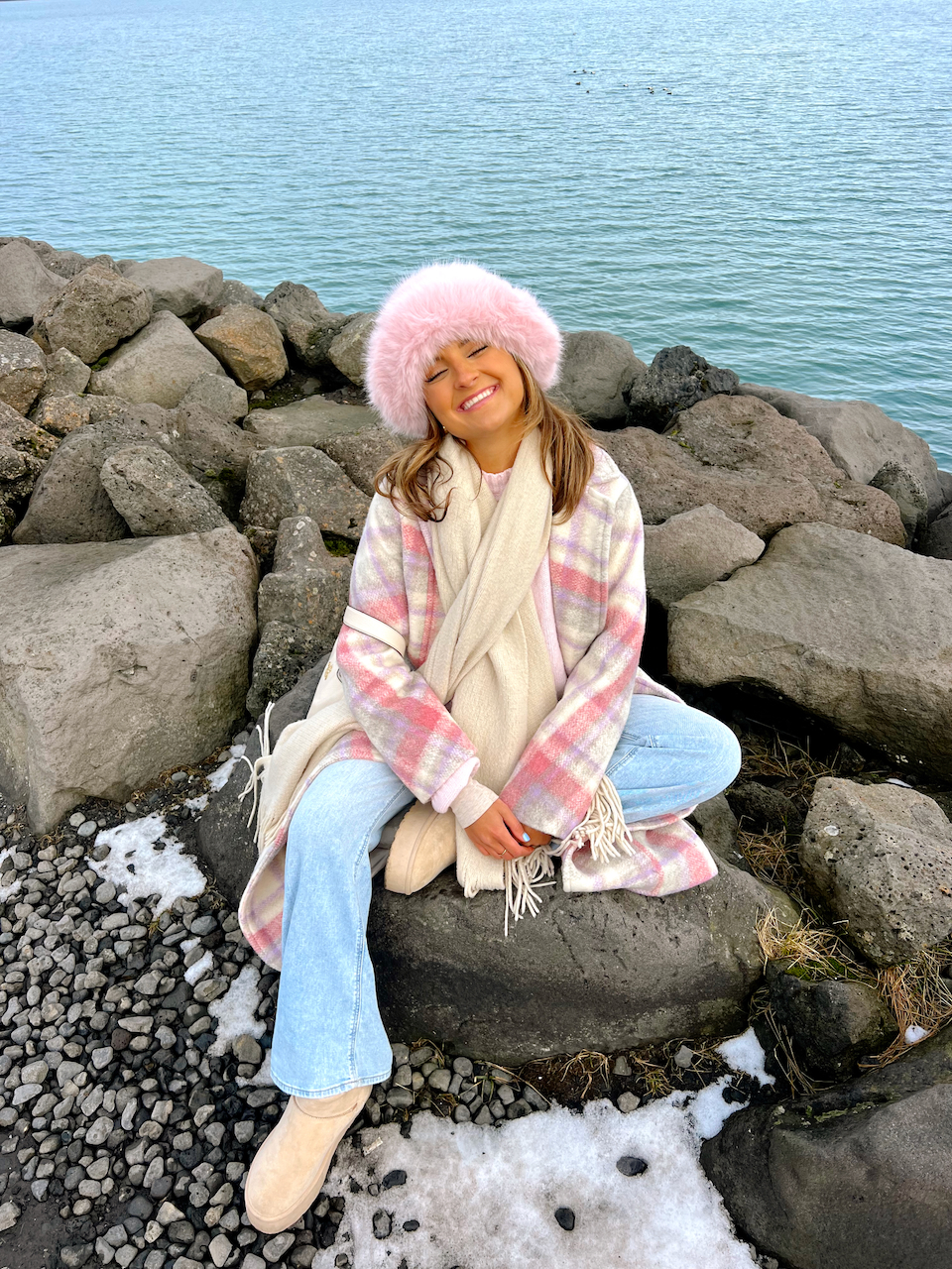 Pink Plaid Coat Over Light Blue Jeans for a Chic Outdoor Look Pink Plaid Coat Over Light Blue Jeans for a Chic Outdoor Look — Iceland Winter Outfits