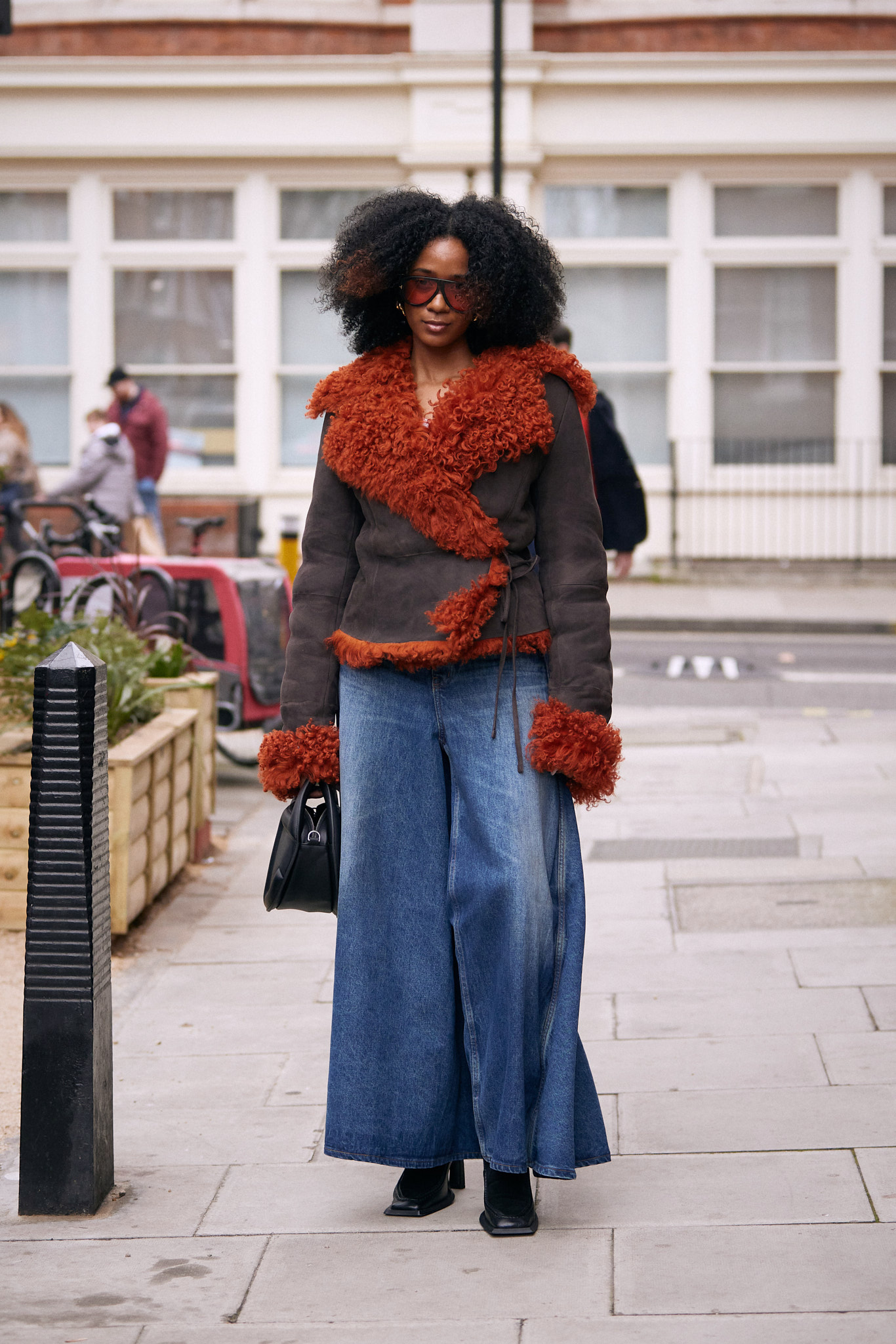 Bold Faux Fur Jacket with Orange Trim and Wide-Leg Jeans — Winter Outfits