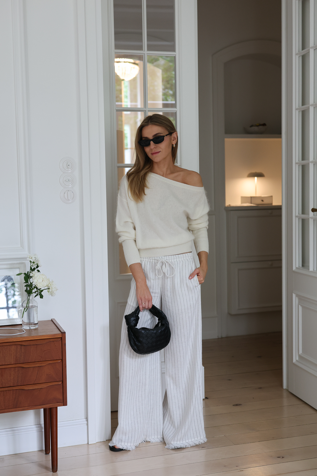 Cream Off-the-Shoulder Knit Sweater with Striped Trousers — Cute Winter Outfits