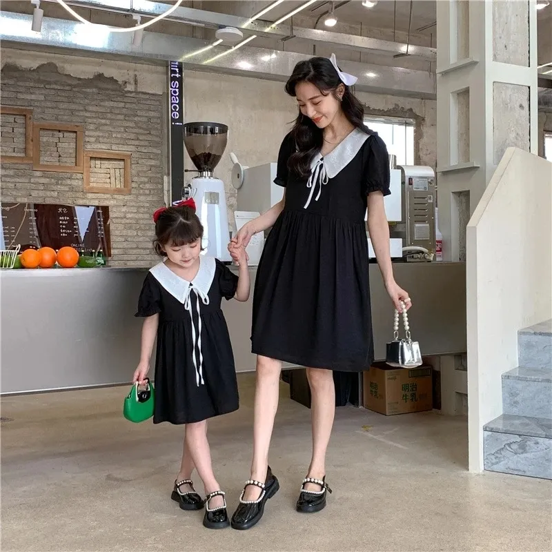 Classic Black Dresses with Peter Pan Collars for a Family Photo — Winter Family Photo Outfits