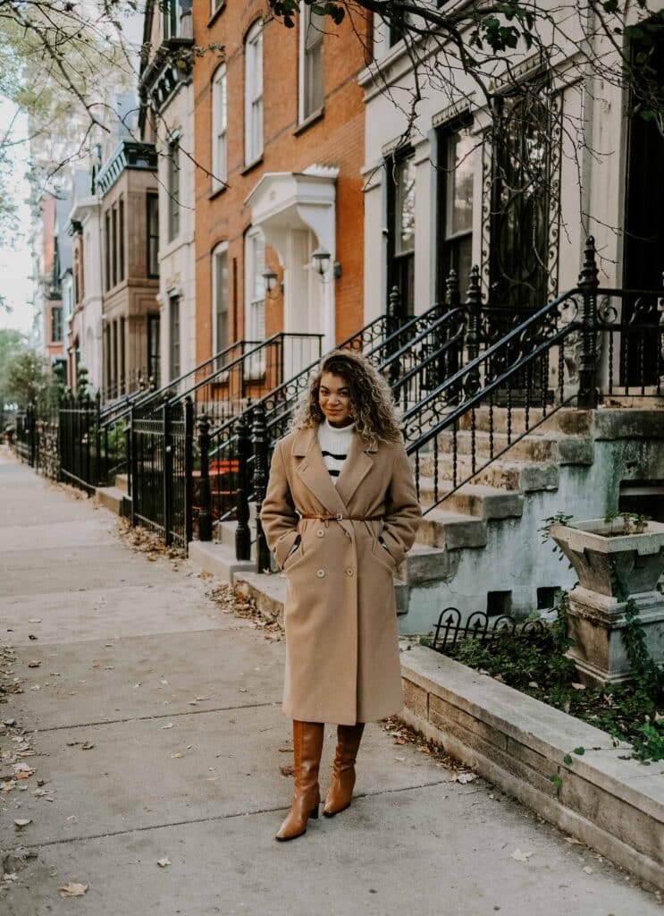 Belted Camel Coat with Striped Sweater and Knee-High Boots — Camel Coat Outfits