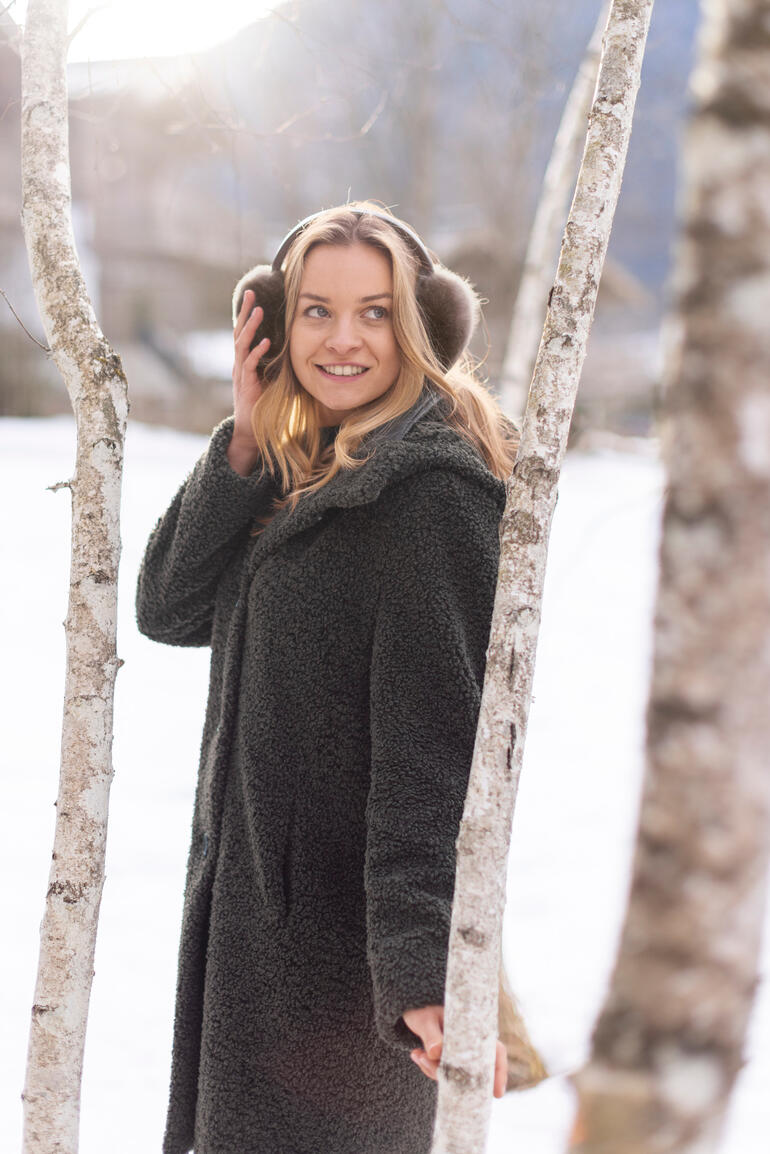 Dark Green Teddy Coat and Earmuffs in Snowy Scenery — Earmuffs Outfits