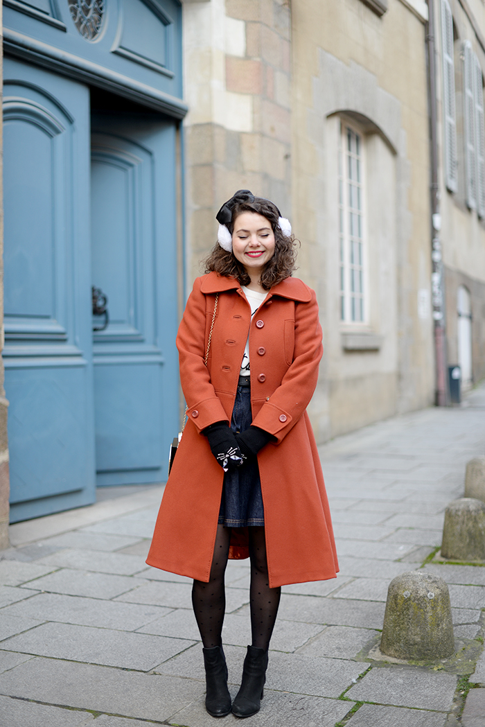 White Earmuffs with an Orange Wool Coat and Denim Skirt — Earmuffs Outfits