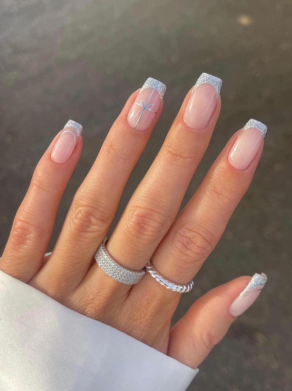 Glossy Sheer Pink Squovals with Silver Glitter French Tips and Bows Glossy Sheer Pink Squovals with Silver Glitter French Tips and Bows — Winter Squoval Nails