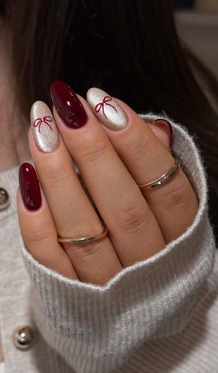 Deep Cherry Red Champagne Shimmer Bow Nails Deep Cherry Red Champagne Shimmer Bow Nails — Cherry Red Christmas Nails 2026