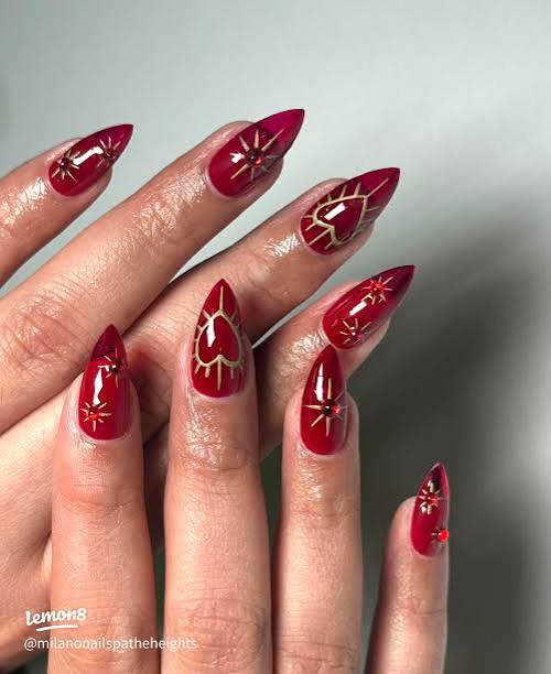 Red Stilettos with Gold Graphic Designs Red Stilettos with Gold Graphic Designs — New Years Stiletto Nails 2027