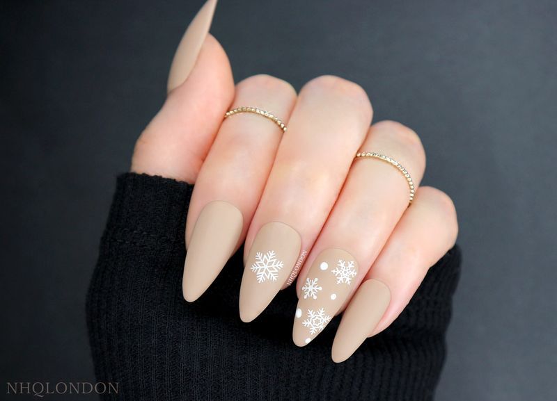 Matte Beige Detailed Snowflake Almonds Matte Beige Detailed Snowflake Almonds — Christmas Almond Nails 2026