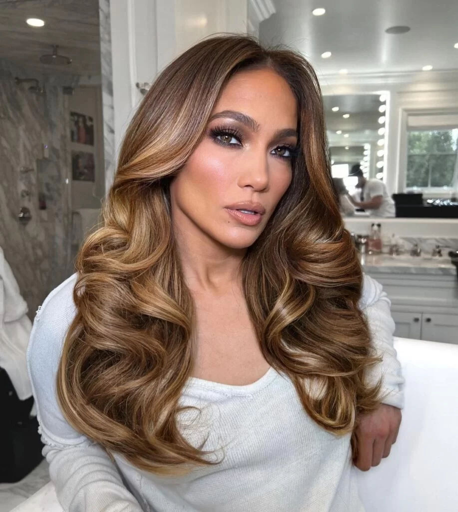 Long Layers Dark Blonde Mid-Back Voluminous Curls With Honey Balayage Long Layers Dark Blonde Mid-Back Voluminous Curls With Honey Balayage — Winter Hair Colors for Women Over 40