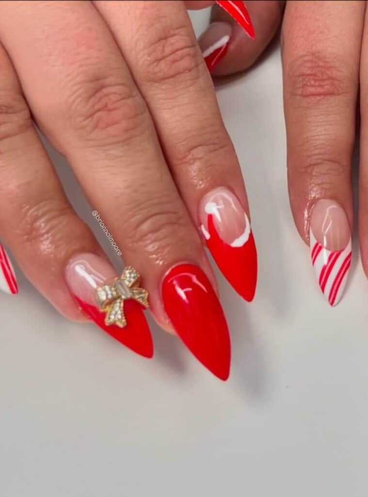 Glossy Red French Tips with Festive Art Glossy Red French Tips with Festive Art — Christmas Stiletto Nails 2026