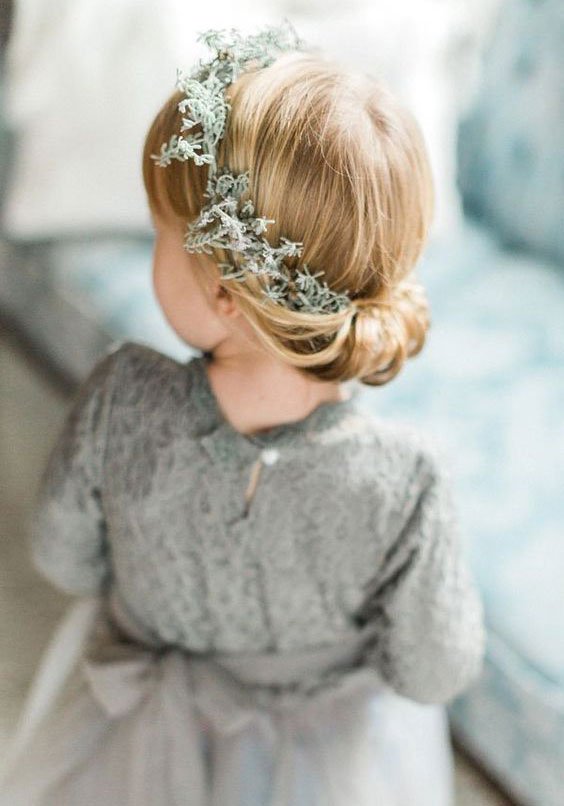 Neat Low Bun with Floral Accent Neat Low Bun with Floral Accent — Winter Hairstyles for Kids