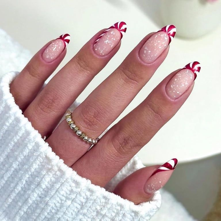 Sheer Nude Candy Cane French Tips Sheer Nude Candy Cane French Tips — Christmas Oval Nails 2026
