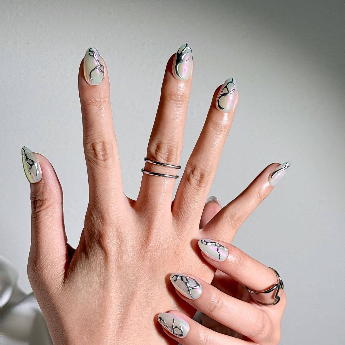 Iridescent Base with Silver Chrome Swirls Iridescent Base with Silver Chrome Swirls — Silver Chrome Nails