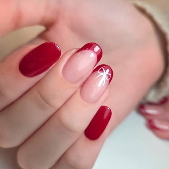 Sheer Nude with Red French Tips and White Bow Almond Nails Sheer Nude with Red French Tips and White Bow Almond Nails — Simple Short Winter Nails