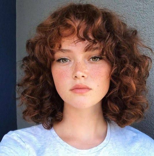 Reddish-Brown Layered Bob With Fringe Reddish-Brown Layered Bob With Fringe — Winter Hairstyles for Curly Hair