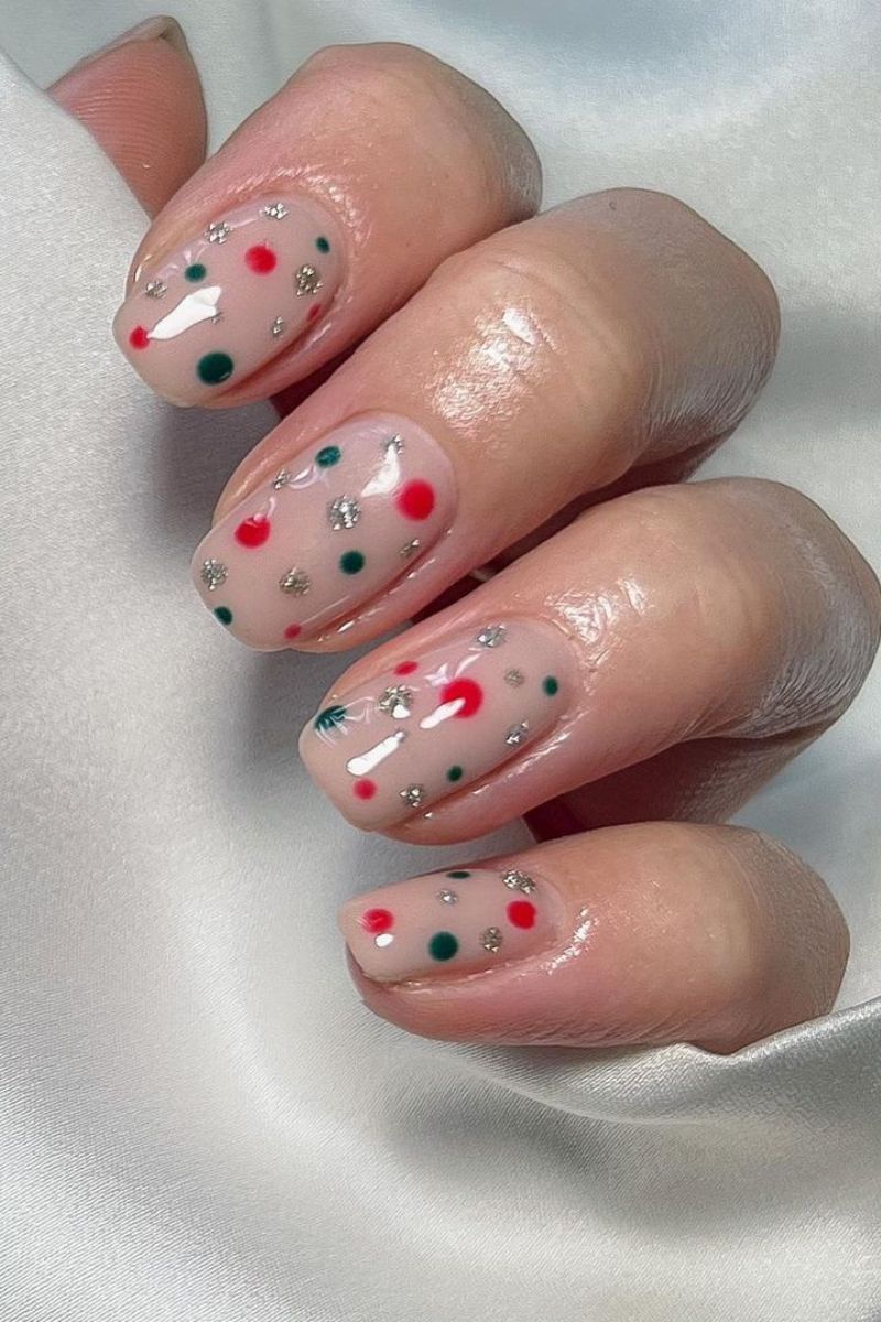 Sheer Nude with Festive Bauble Dots Sheer Nude with Festive Bauble Dots — Short Christmas Nails 2026