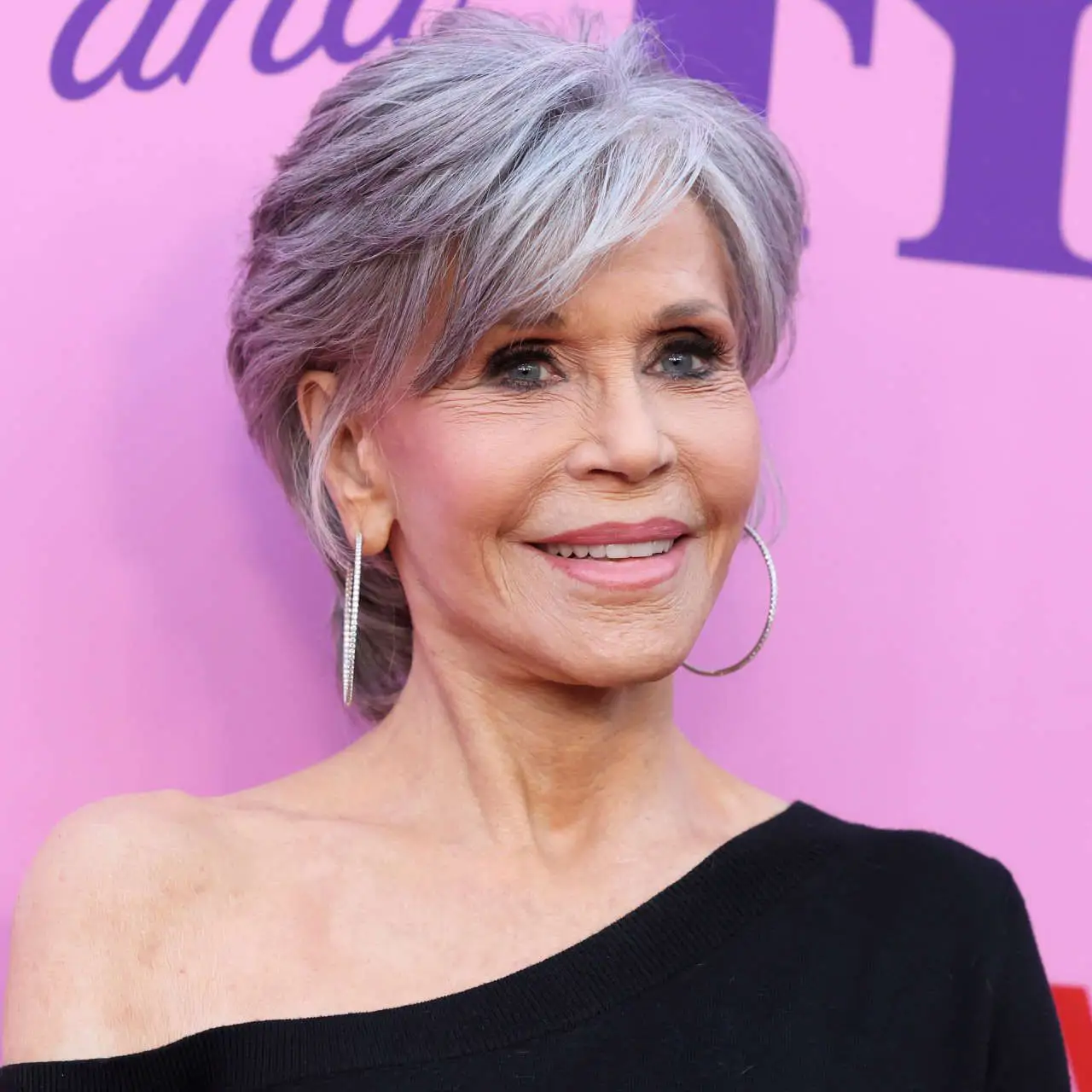 Ear Vibrant Silver Pixie with Swept Bangs Ear Vibrant Silver Pixie with Swept Bangs — Winter Hair Colors for Women Over 70