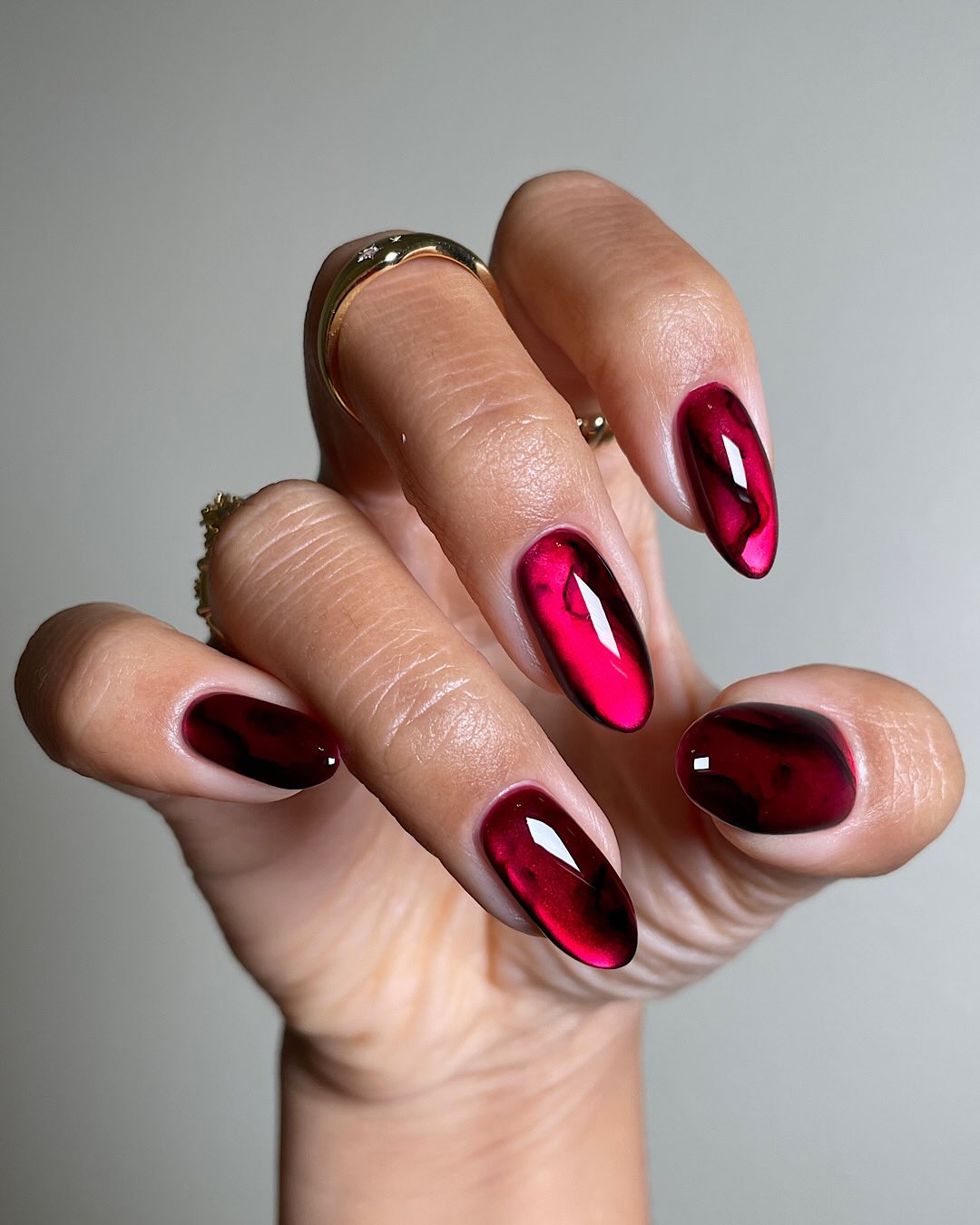 Vibrant Deep Red Jelly Swirls Vibrant Deep Red Jelly Swirls — New Years Nail Designs 2027