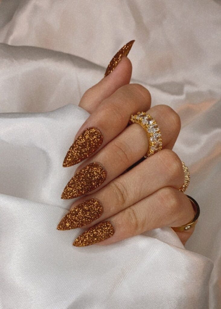 Deep Bronze Glitter Stilettos Deep Bronze Glitter Stilettos — New Years Stiletto Nails 2027
