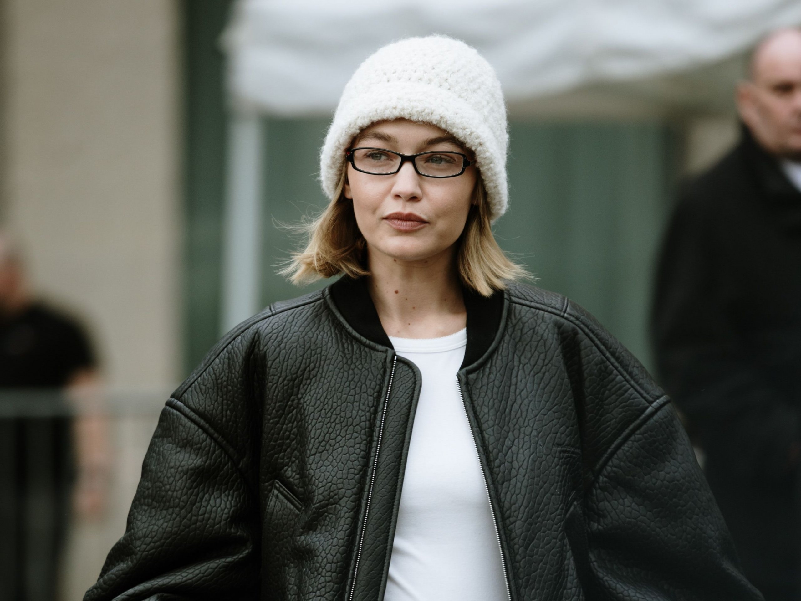 Chin Length Blonde Bob With White Beanie — Winter Hat Hairstyles