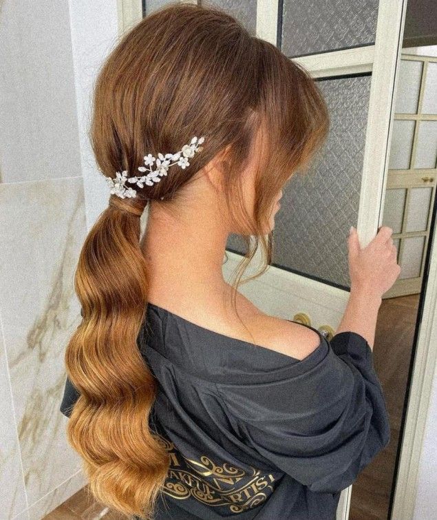 Warm Brown Low Ponytail With Waves Warm Brown Low Ponytail With Waves — Winter Formal Hairstyles
