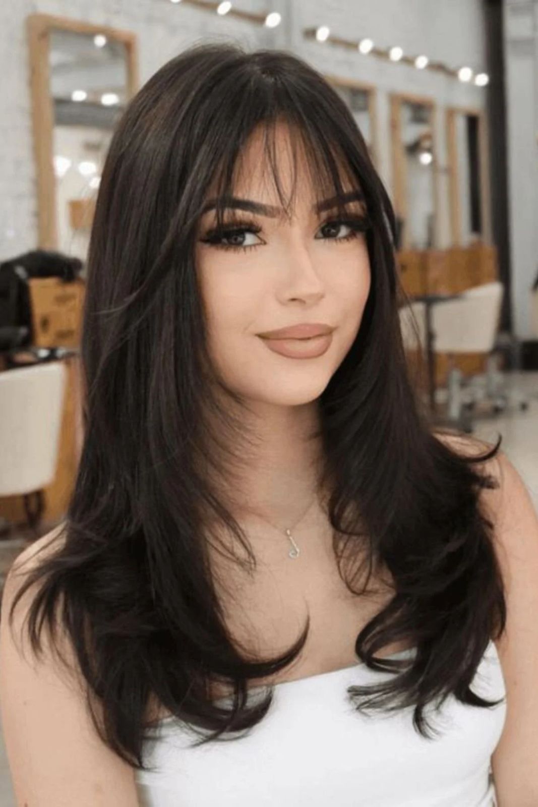 Thick Dark Brown Layers With Wispy Bangs Thick Dark Brown Layers With Wispy Bangs — Winter Hairstyles for Long Hair