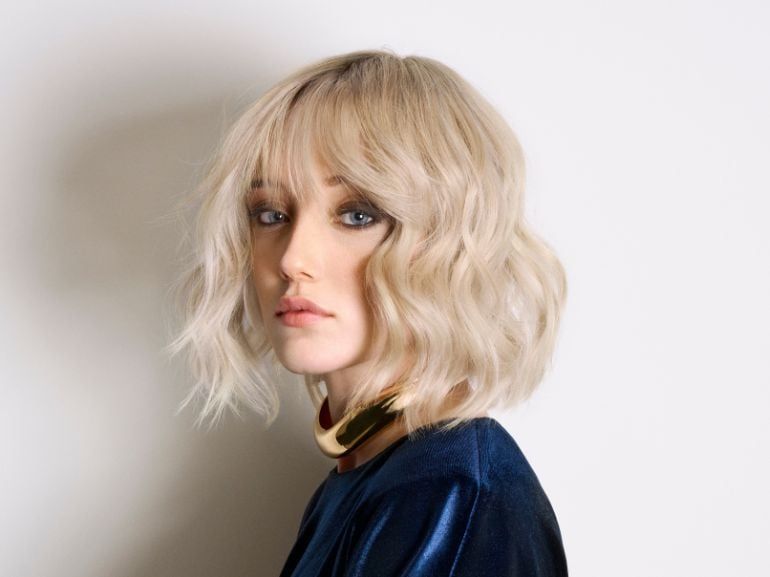 Ash Blonde Bob With Blunt Bangs — The Ash Blonde Hair Has A Side Parting Ash Blonde Bob With Blunt Bangs — The Ash Blonde Hair Has A Side Parting — Winter Haircuts for Wavy Hair