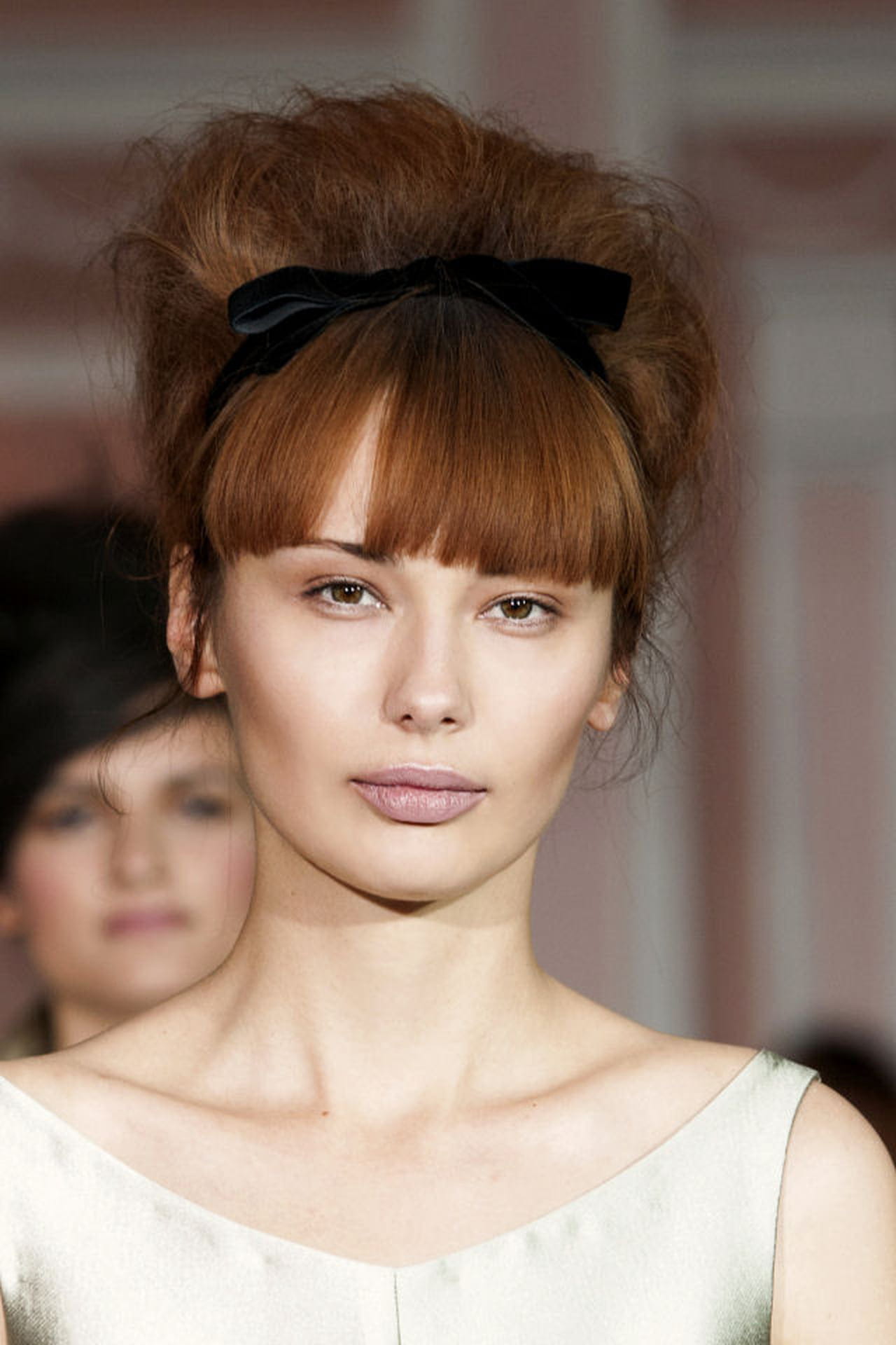 Voluminous Updo With Blunt Bangs and Black Bow Voluminous Updo With Blunt Bangs and Black Bow — Cute Winter Hairstyles