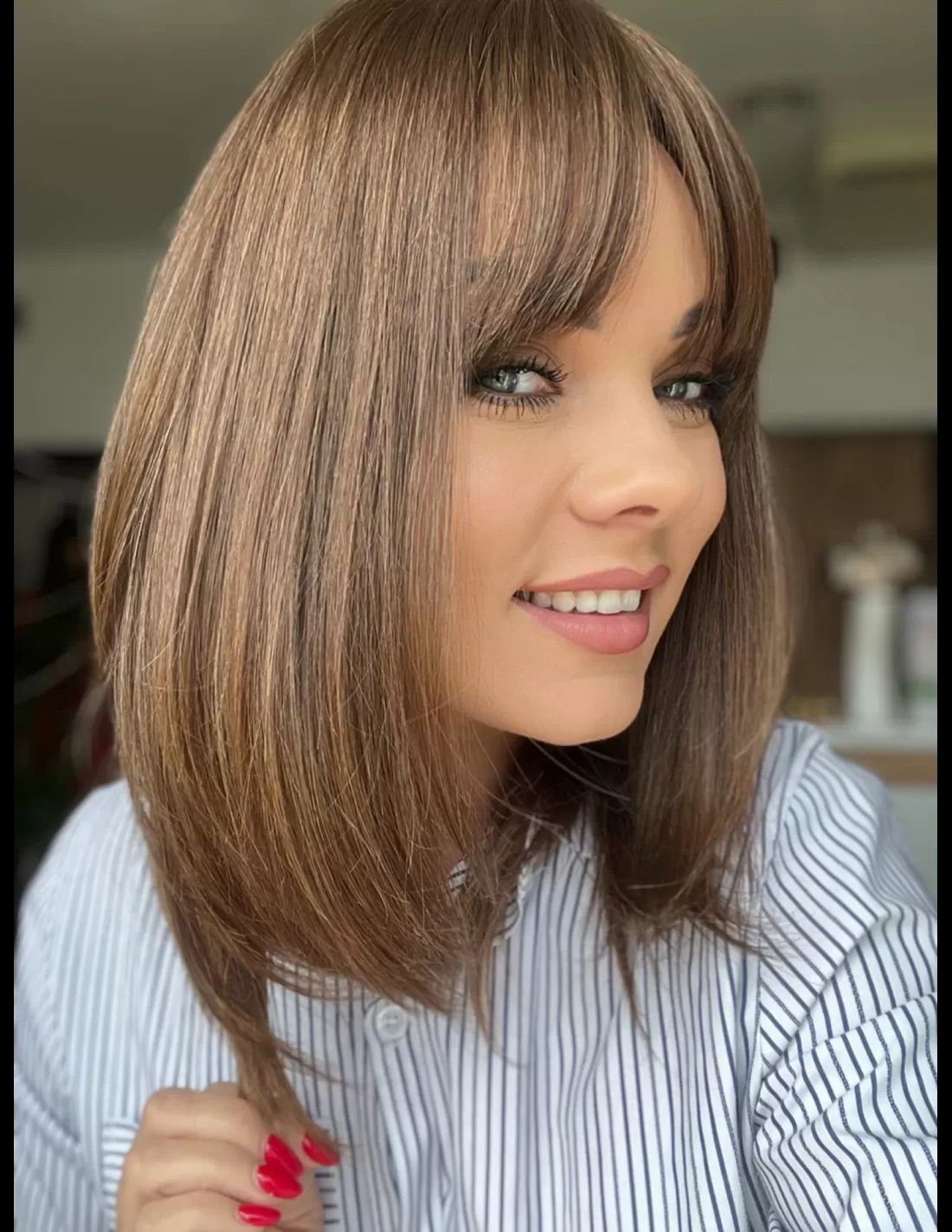 Medium Brown Blunt Bob With Sleek Bangs — Winter Haircuts for Square Faces