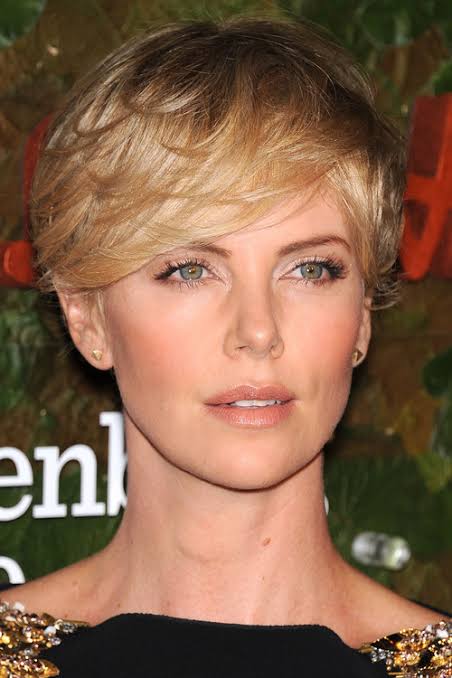Ash Blonde Pixie With Side-Swept Bangs Ash Blonde Pixie With Side-Swept Bangs — Winter Haircuts with Bangs