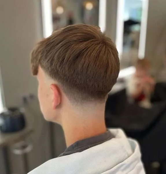 Taper Fade With Messy Textured Top Taper Fade With Messy Textured Top — Winter Haircuts for Boys