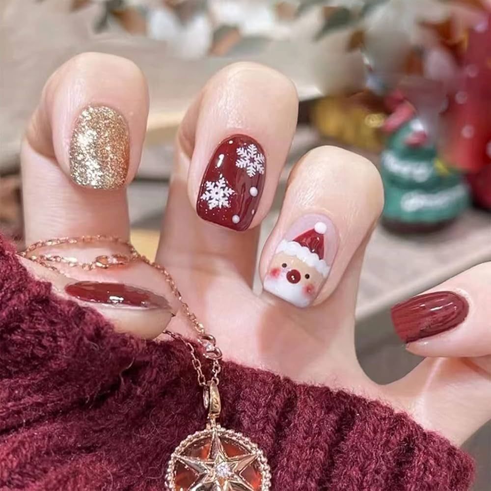 Red Nails with Snowflake and Santa Face Art Red Nails with Snowflake and Santa Face Art — Short Christmas Nails 2026