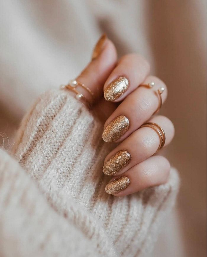Vibrant Warm Gold Glitter Ovals — Simple New Years Nails 2027