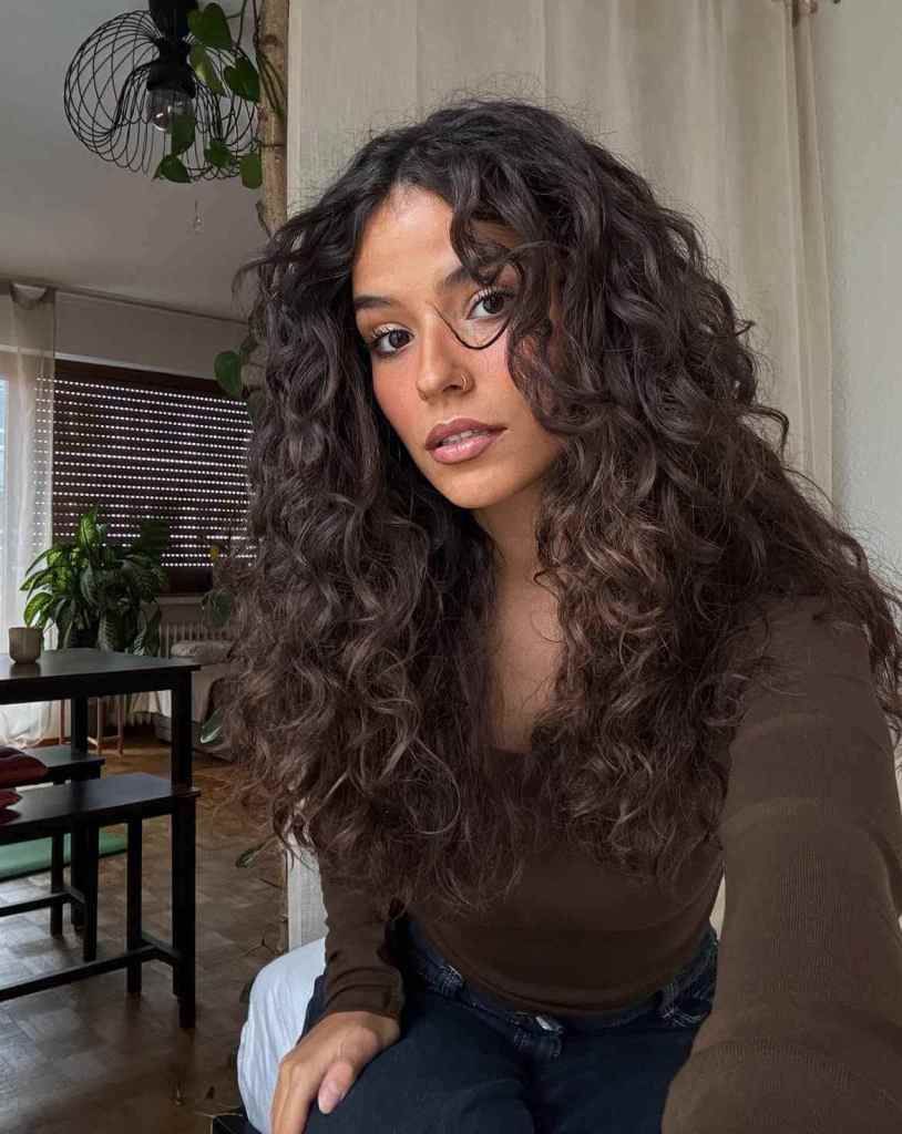 Dark Brown Curly Shag With Choppy Bangs Dark Brown Curly Shag With Choppy Bangs — Winter Hairstyles for Curly Hair