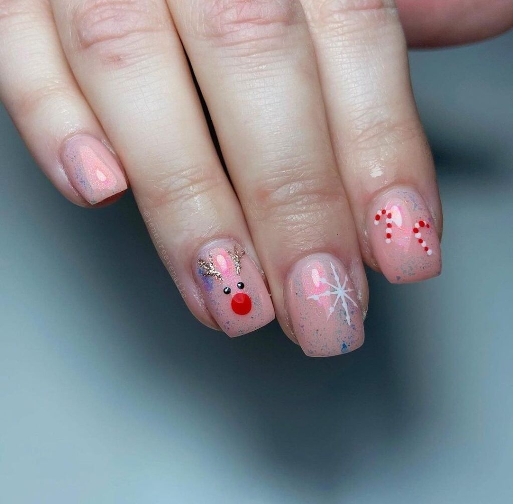 Pale Pink Reindeer and Candy Cane Nails Pale Pink Reindeer and Candy Cane Nails — Christmas Nails for Kids 2026
