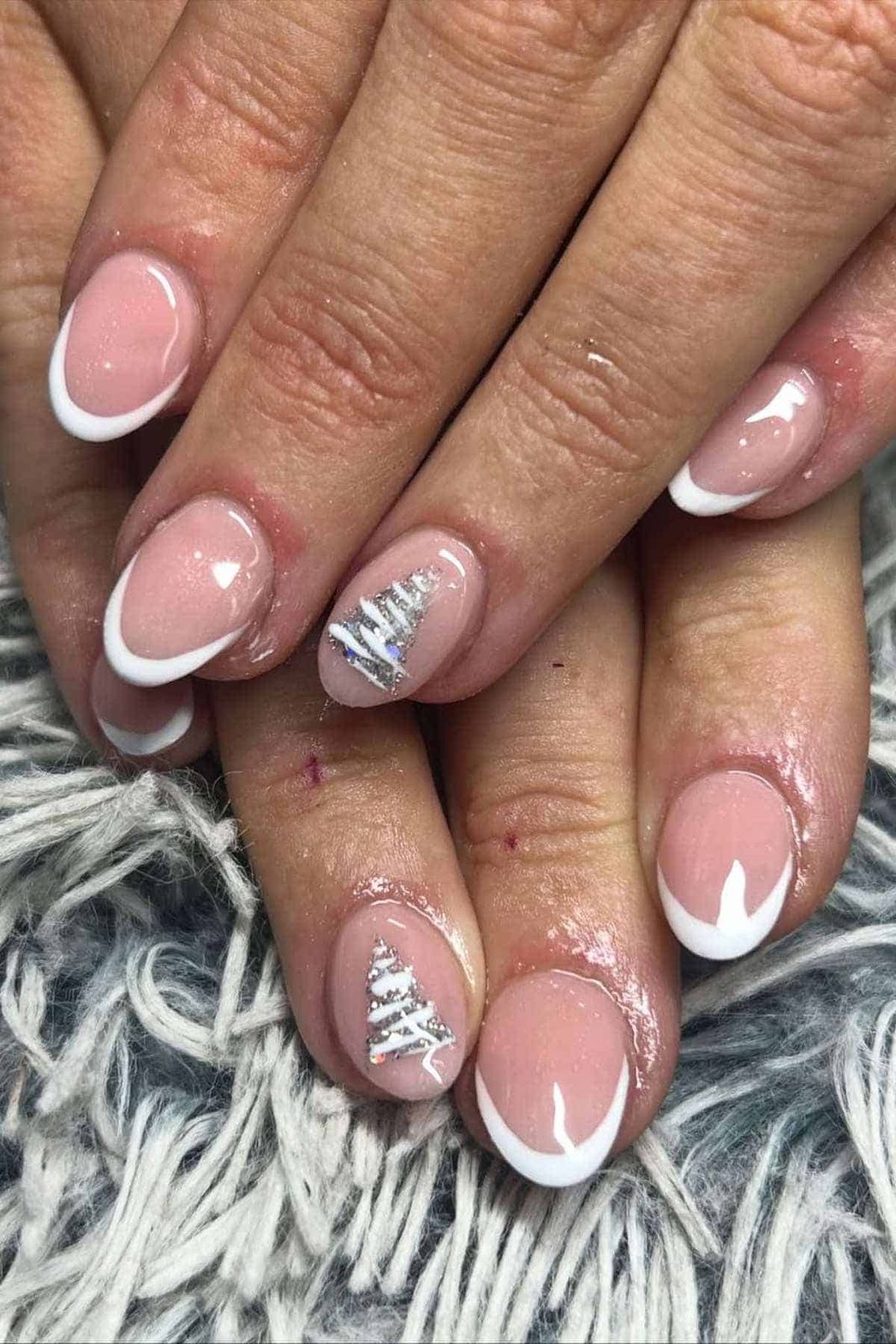 French Manicure with Glitter Tree Accents French Manicure with Glitter Tree Accents — Christmas Oval Nails 2026