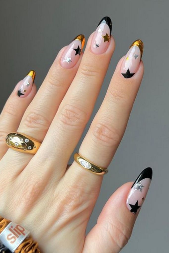 Sheer Nude Stilettos with Black French and Star Decals Sheer Nude Stilettos with Black French and Star Decals — New Years Nails 2027