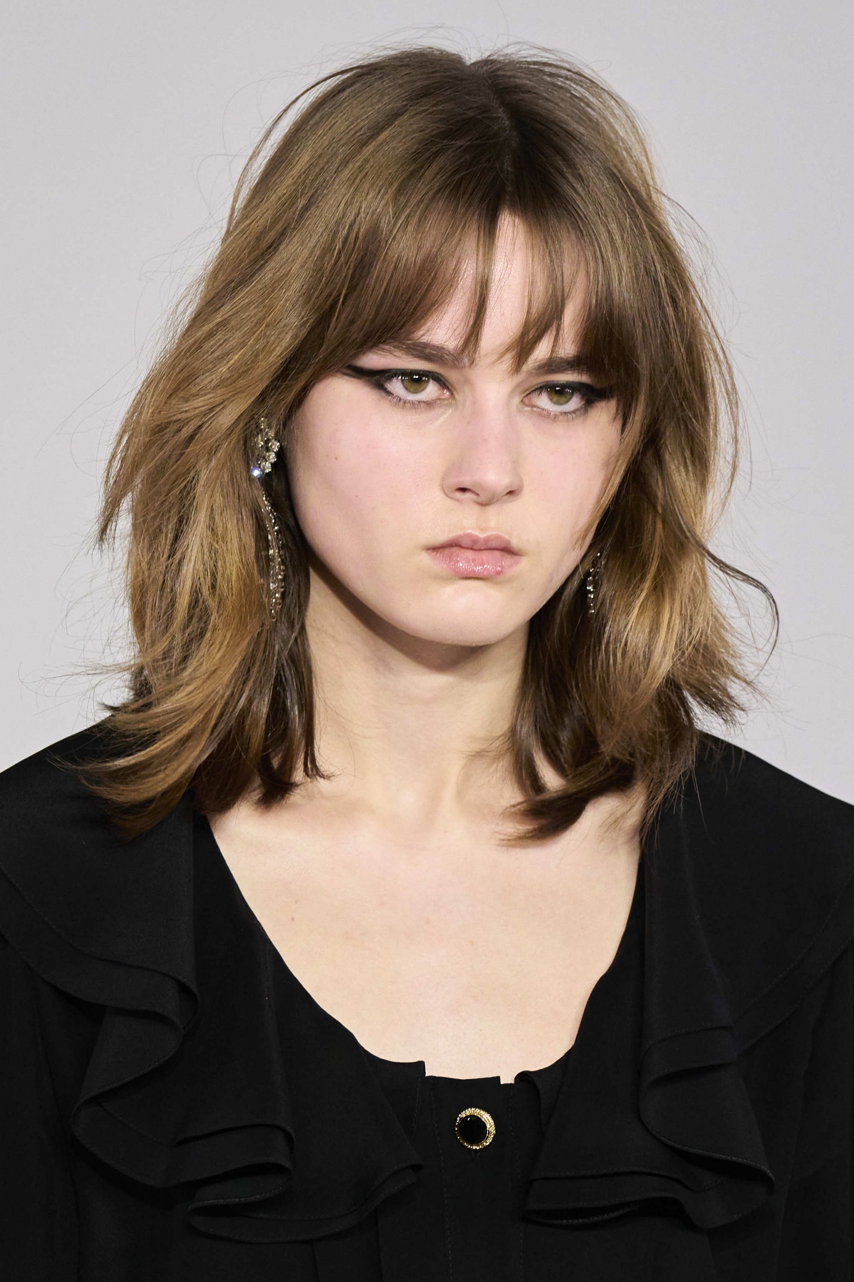 Medium Brown Layered Cut With Side-Swept Wispy Bangs Medium Brown Layered Cut With Side-Swept Wispy Bangs — Winter Haircuts with Bangs