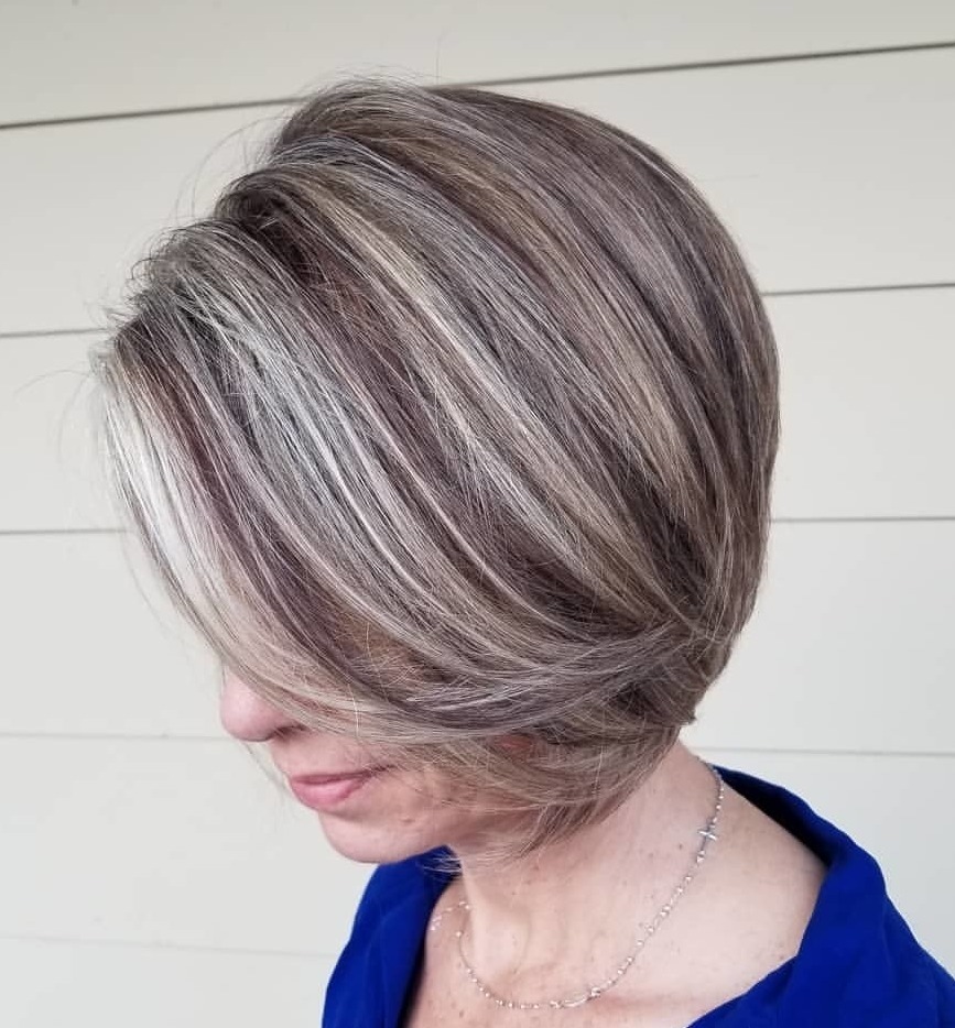 Ash Blonde Bob With Layered Forward Swept Bangs Ash Blonde Bob With Layered Forward Swept Bangs — Winter Hair Colors for Women Over 40