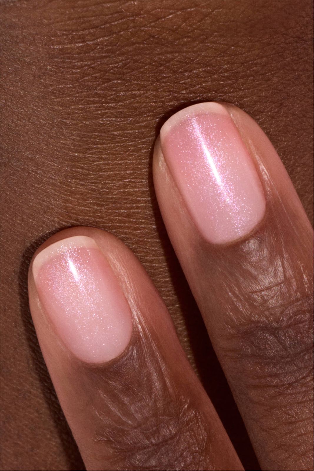 Close Macro Of Two Fingers Short Oval Pale Pink Iridescent Shimmer — Winter Champagne Nails