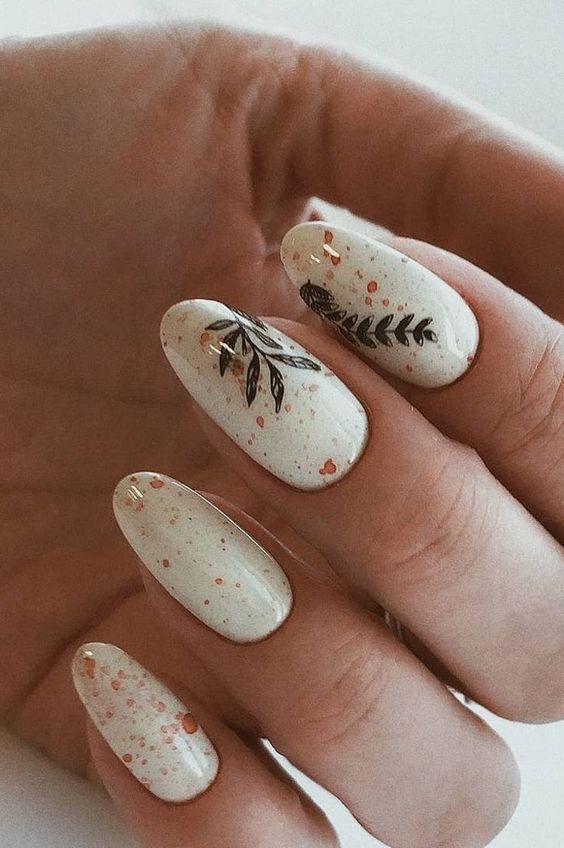 Glossy Speckled Leaves Oval Nails Glossy Speckled Leaves Oval Nails — Winter to Spring Transition Nails