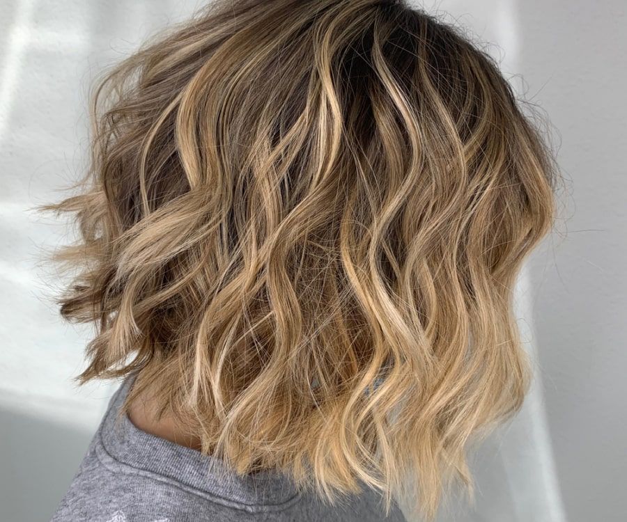 Collarbone Shag With Wispy Bangs Collarbone Shag With Wispy Bangs — Winter Haircuts for Wavy Hair