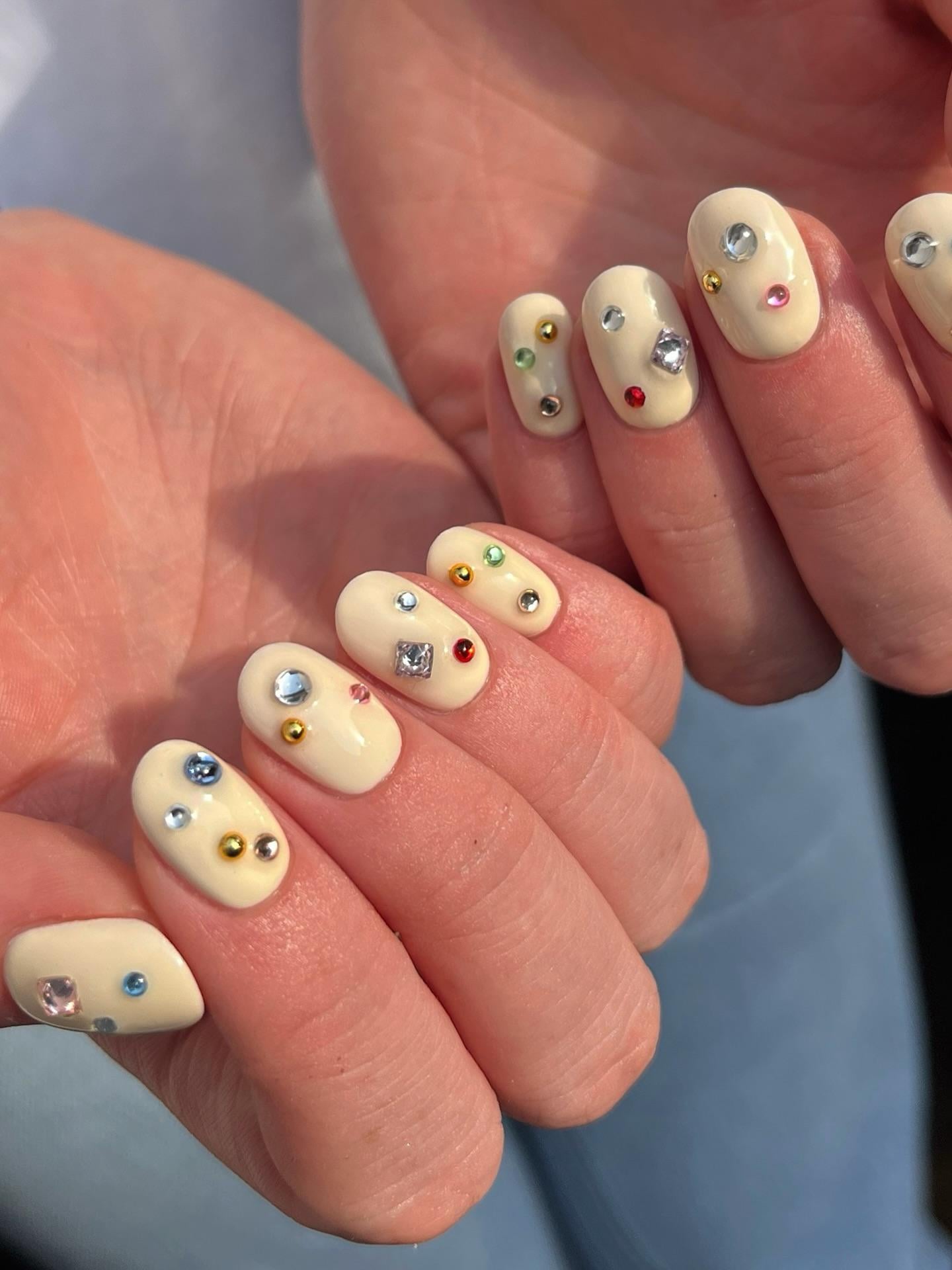 Pale Yellow with Rhinestone and Gold Studs Pale Yellow with Rhinestone and Gold Studs — Winter Nail Colors for Women Over 70