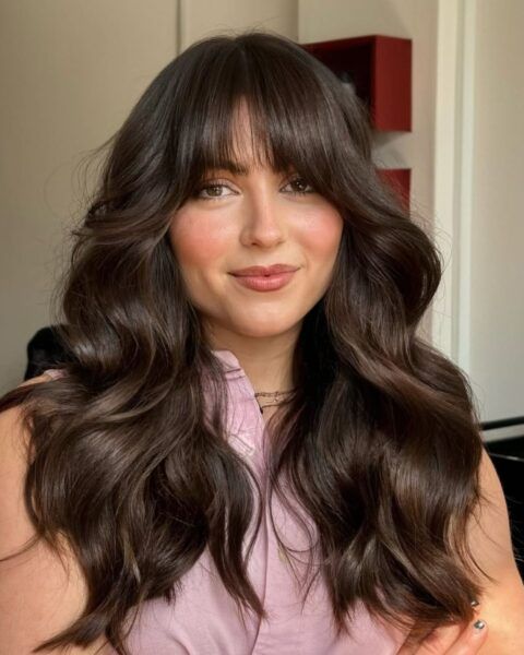 Voluminous Collarbone Waves With Curtain Bangs Voluminous Collarbone Waves With Curtain Bangs — Winter Haircuts for Thick Hair