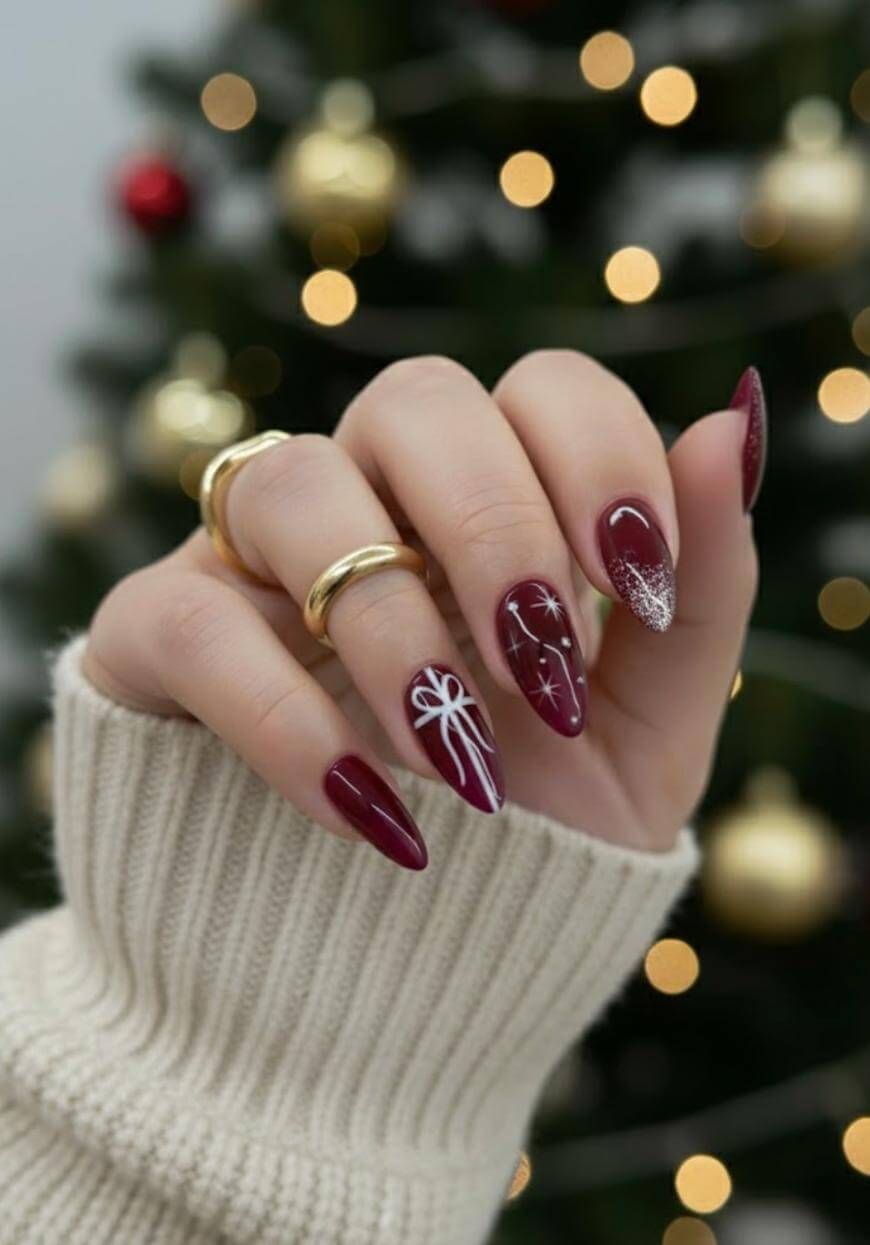 Burgundy Bow Starburst Almond Nails Burgundy Bow Starburst Almond Nails — Classy Christmas Nails 2026
