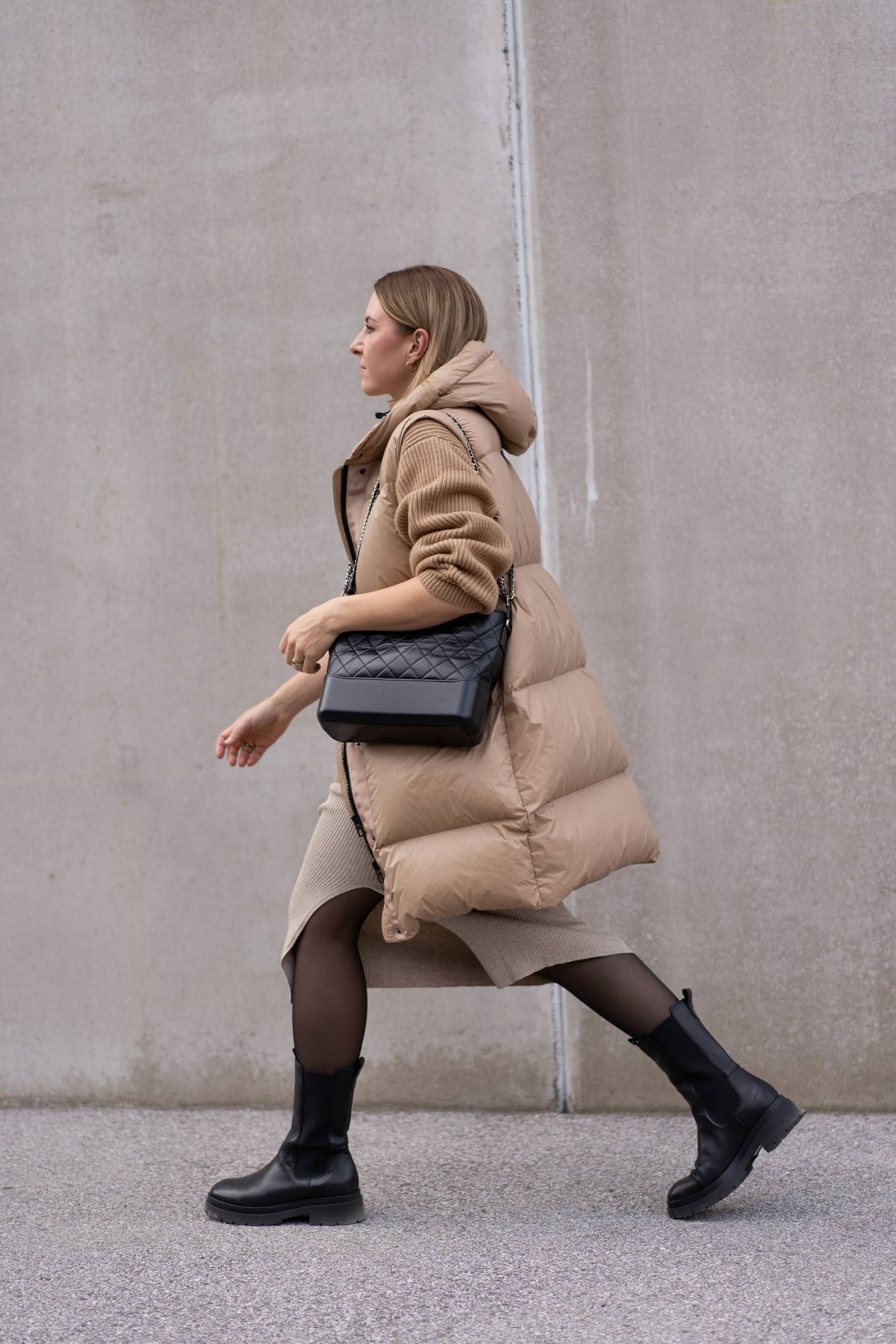 Puffer Vest Layered Over Knit for Casual Comfort — Las Vegas Winter Outfits
